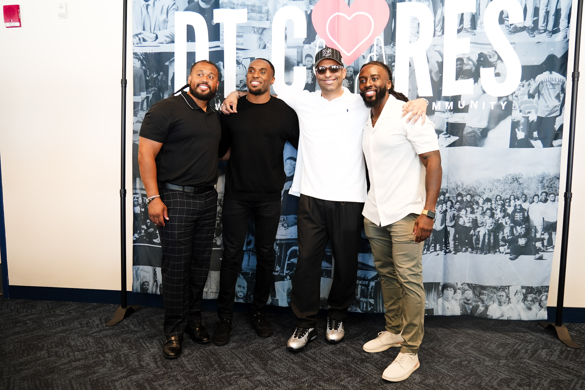 DT Cares founders and keynote guest at the backdrop